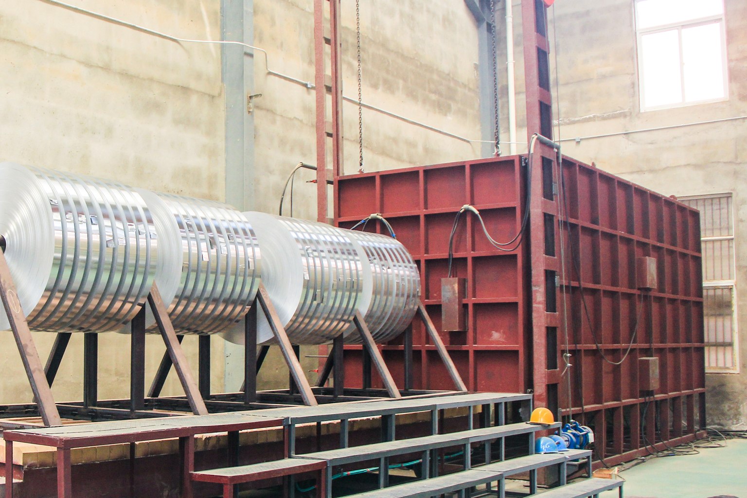 Aluminium strip coils positioned beside the annealing furnace